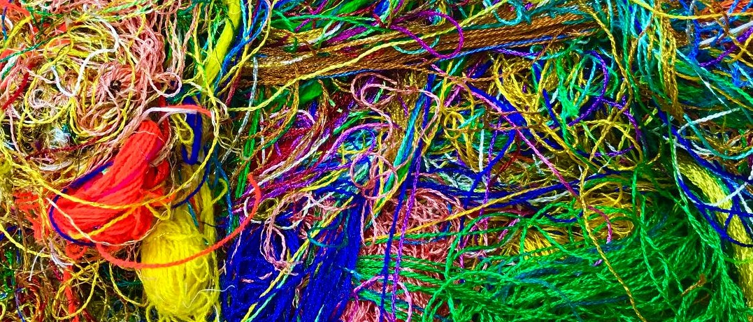 colorful thread in a pile