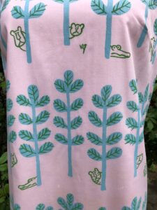pink dress with trees and animals 